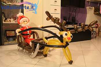 Babbo Natale con slitta e Renna