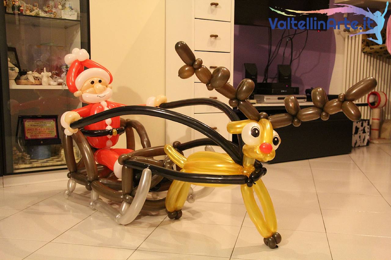 Babbo Natale con slitta e Renna